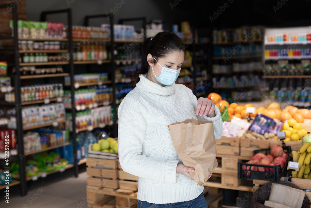 Shopping at small grocery shop during the covid-19 pandemic.