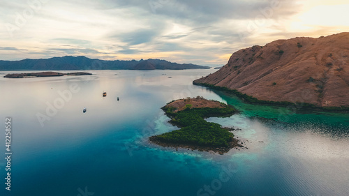 Aerial view of calm sea with sailing boat in Kalong Island, Komodo National Park, Labuan Bajo, Indonesia