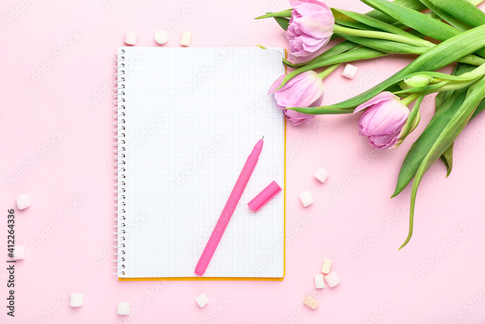 Obraz premium Spring planning and creative inspiration, open notebook with pink pen and fresh tulips on pastel background for feminine lifestyle and stationery design