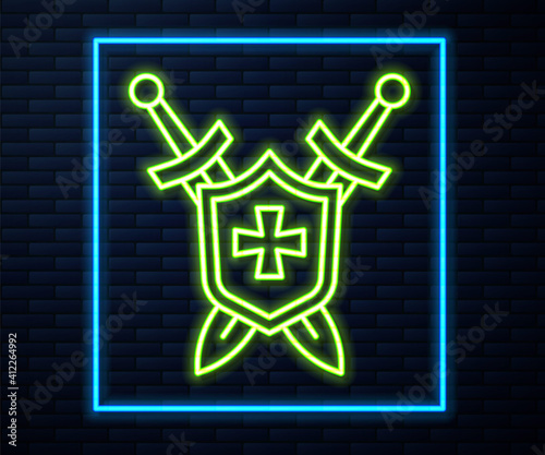 Glowing neon line Medieval shield with crossed swords icon isolated on brick wall background. Vector.