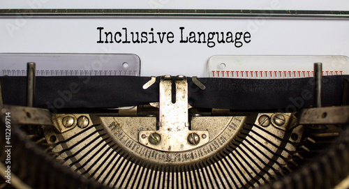 Inclusive language symbol. Words 'Inclusive language' typed on retro typewriter. Business, inclusion and Inclusive language concept. Beautiful background.