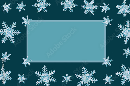 Artificial snowflakes isolated on blue background. Copy space