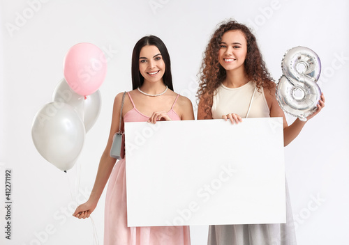 Beautiful women with balloo...