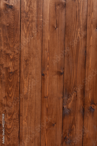 Brown wooden background. textures textured rustic board. Wooden Wall Covering Of Vertical Texture. Battered Background. Weathered Vintage Surface. Rough External Structure. old grunge wood paneling.