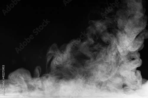 Blur white water vapour on isolated black background. Abstract of steam with copy space. Steam flow. Smoke on white background.