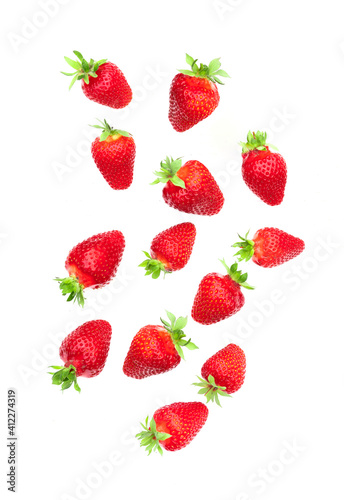 Falling strawberries  on white background