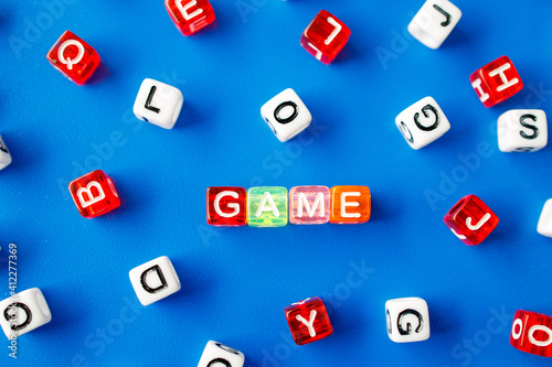 the word game is made from letters on colorful cubes