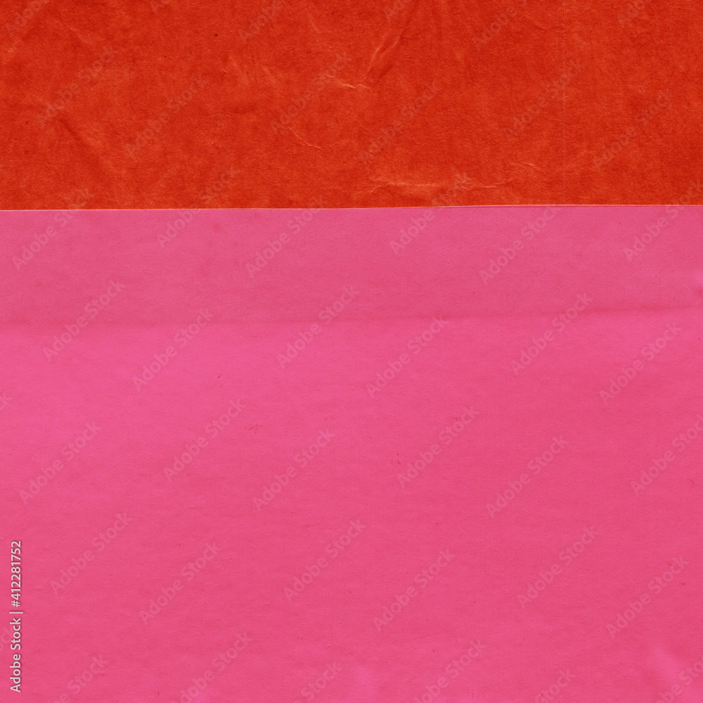 Fototapeta premium Red and brown torn paper collage close-up. Texture made from various paper and cardboard parts. Damaged old paper background. Vintage blank wallpaper. Material design backdrop.