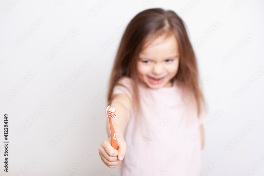 little girl with light brown hair and blue eyes with a toothbrush in her hands in the foreground. Neutral tones. Dentistry. Hygiene. dental health. Space for text, white background
little girl with light brown hair and blue eyes with a toothbrush in her hands in the foreground. Neutral tones. Dentistry. Hygiene. dental health. Space for text, white background