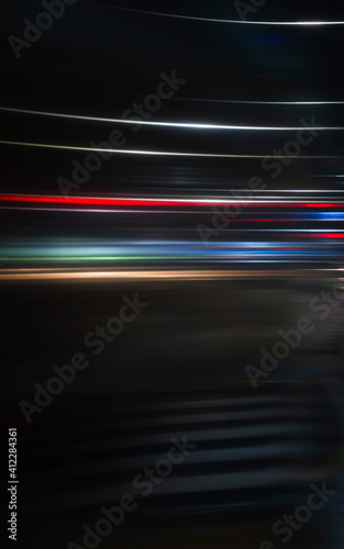 Abstract blurred lights of a night city, vertical photo