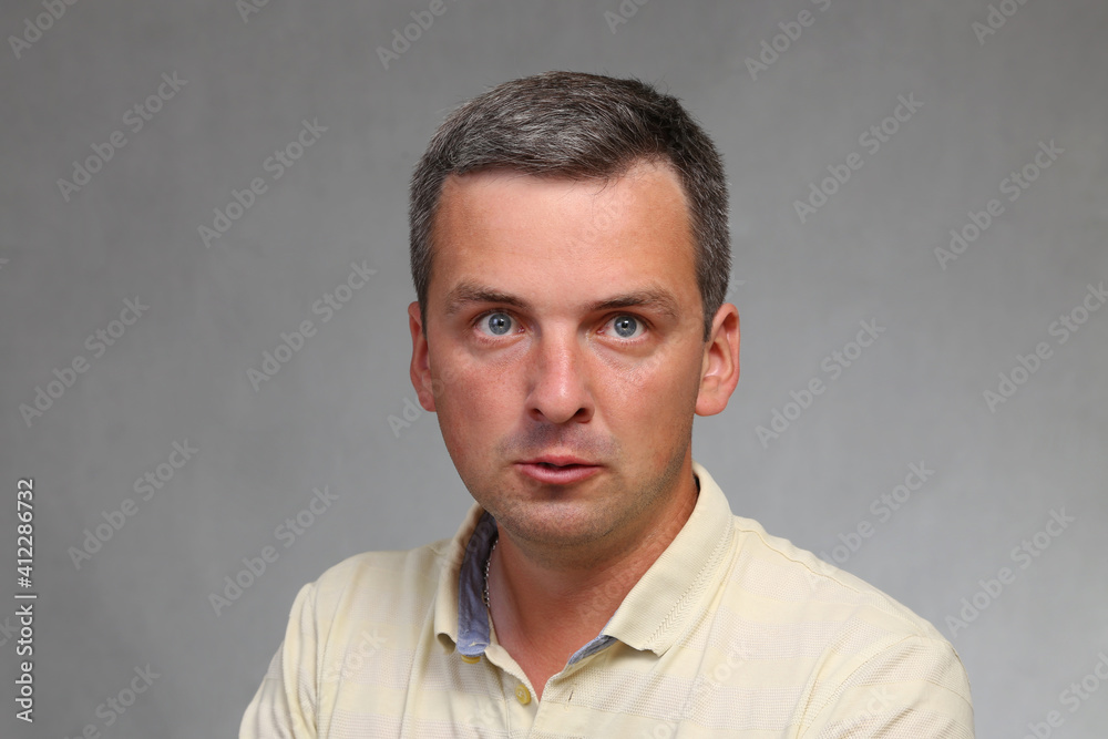 Crazy guy. Man with suspicious look of schizophrenic. Portrait of a neurotic. People react negatively to problems.