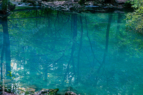 Fototapeta Naklejka Na Ścianę i Meble -  Ochiul Beiului, a small emerald lake on the Nera gorge in Beusnita National Park in Romania