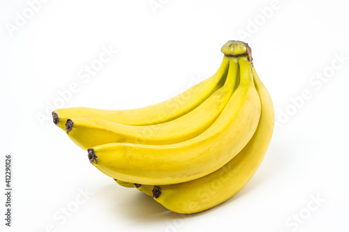 Bananas on a white background. Fresh yellow bananas. Banana bunch isolated. Exotic fruit