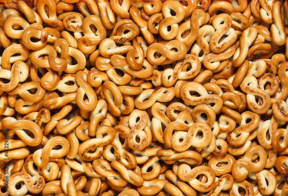 Eight-shaped smooth bagels background. Top view. Eight-shaped smooth bagels background. Top view.