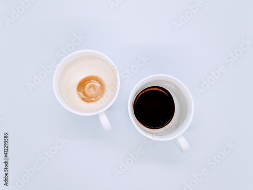 dirty cups after coffee. two empty and dirty cups after coffee on a white background top view