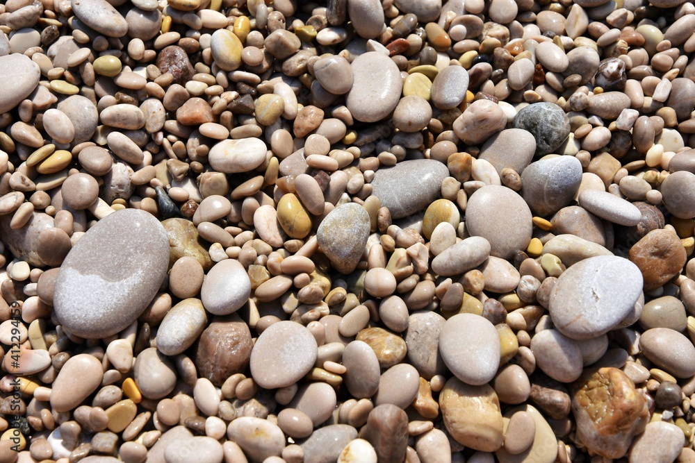Round wet sea pebbles background, soft focus. Colorful smooth round pebbles sea texture backdrop Round wet sea pebbles background, soft focus. Colorful smooth round pebbles sea texture backdrop