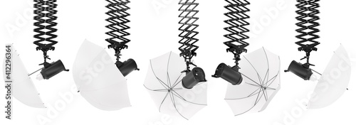 Photography studio flash on ceiling pantograph with umbrella isolated on white.