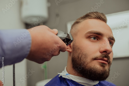 Young Man in Barbershop Hair Care Service ConceptYoung Man in Barbershop Hair Care Service Concept