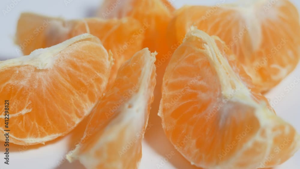 Tangerine slices on a rotating table. Tangerine slices on a rotating table.