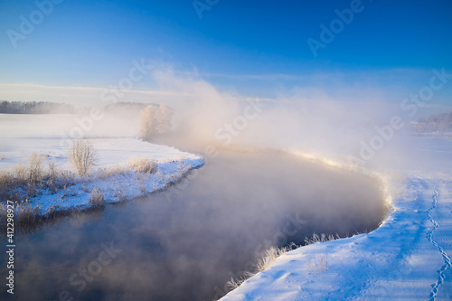Cute morning landscape in winter on the river