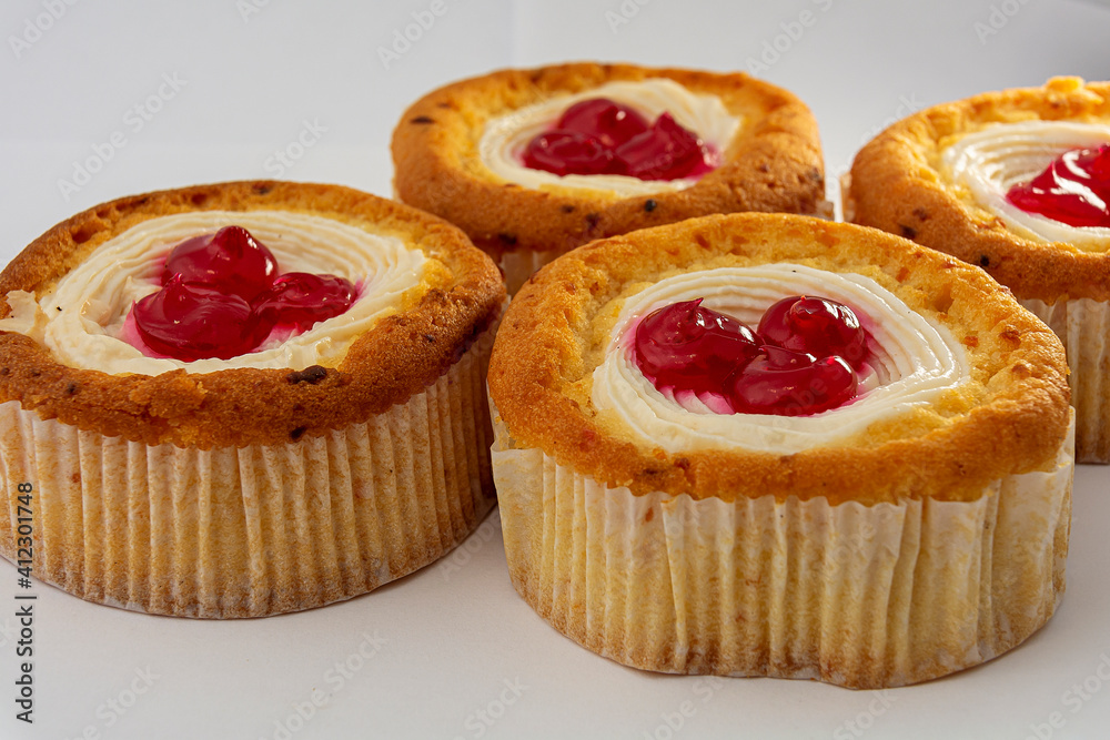 Sponge cake with cream and decorated with berries. A cake in the form of a basket with whipped cream. Sponge cake with cream and decorated with berries. A cake in the form of a basket with whipped cream.