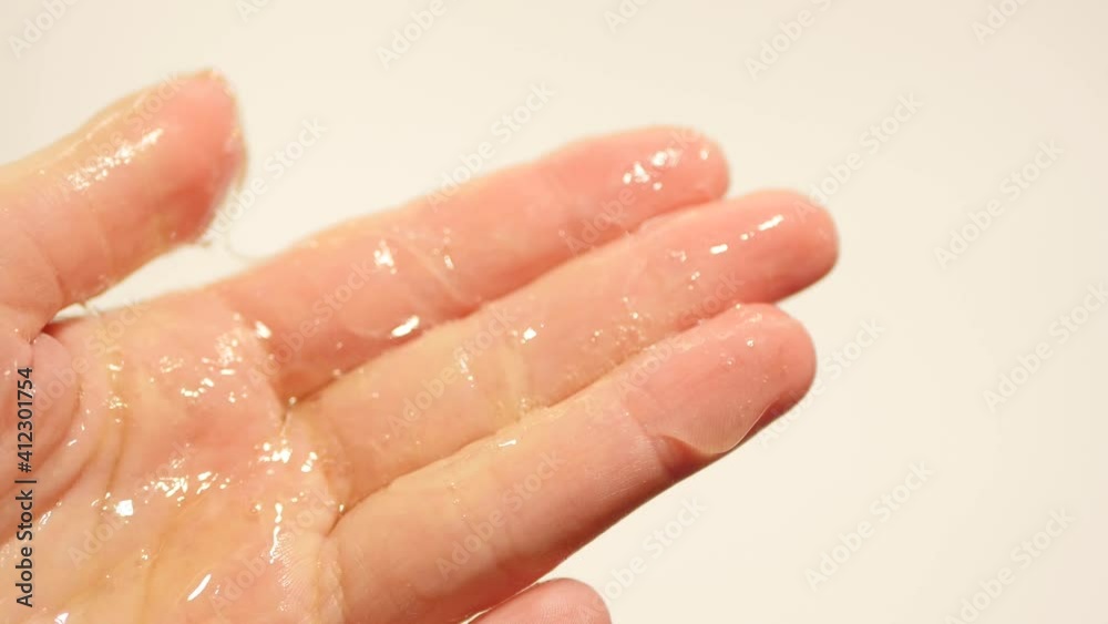 Close up applying gel on hands. Cleanser using. Self hygiene Close up applying gel on hands. Cleanser using. Self hygiene