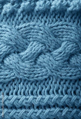 Blue knitted handmade warm textured background close-up © MML Photography