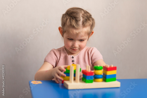  Children's wooden toy. The child collects the sorter. Educational logic toys for children. Montessori games for child development