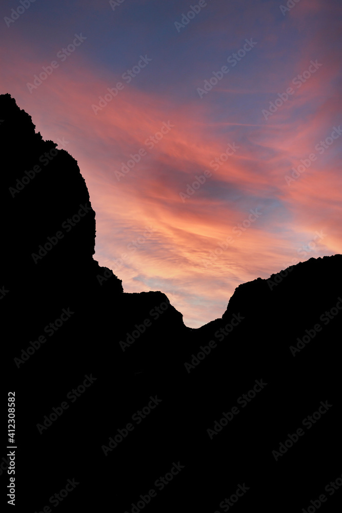 silhouette of mountains with red sunrise