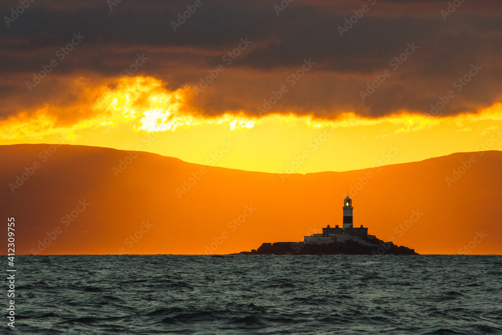Sun setting upon a lighthouse. Sun setting upon a lighthouse.