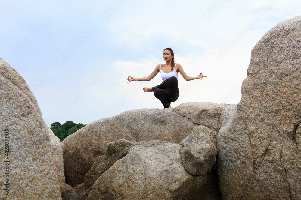 Asian woman in Yoga position Asian woman in Yoga position