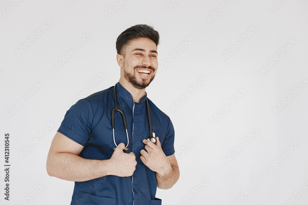 International medical student. Man in a blue uniform. Doctor with stethoscope. International medical student. Man in a blue uniform. Doctor with stethoscope.