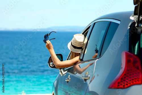 Photography driver girl  in car at sea in summer
