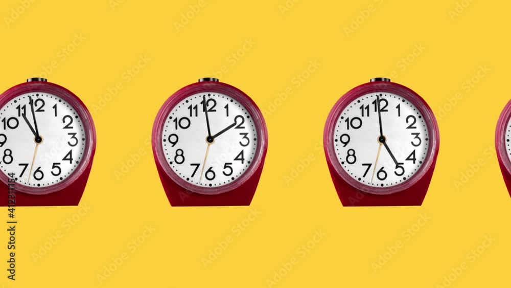 seamless looping animation with one row of classic red plastic alarm clocks with big numerals on a yellow background seamless looping animation with one row of classic red plastic alarm clocks with big numerals on a yellow background