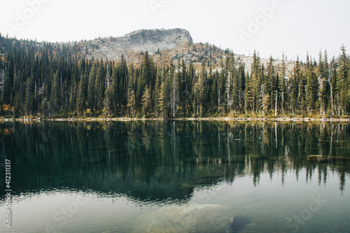 Alpine lake on a smoky afternoon. photo