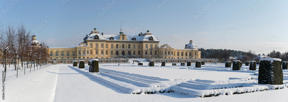 Snowy winter view over the Drottningholm island with castle and the French park in Stockholm