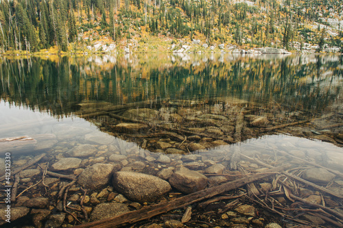 Lake bed on clear alpine lake. photo