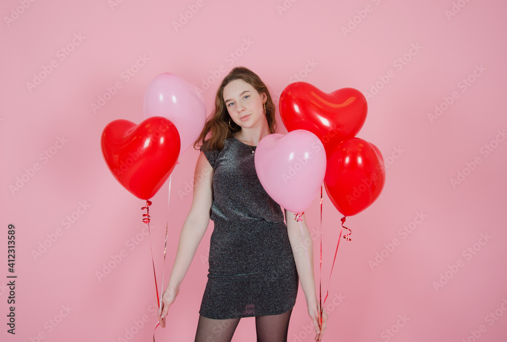 girl with balloons on a pink background. concept of mothers day, valentines day, womens day, birthday - obrazy, fototapety, plakaty 
