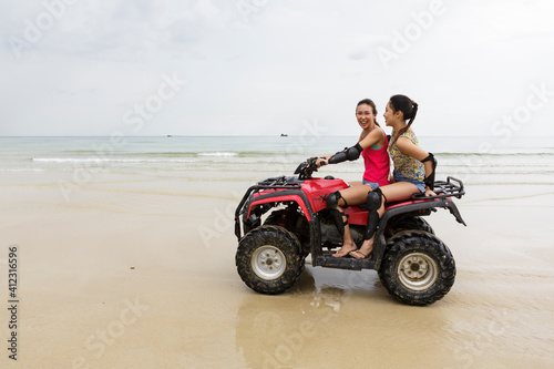 Wallpaper Mural Two girls driving an ATV Torontodigital.ca
