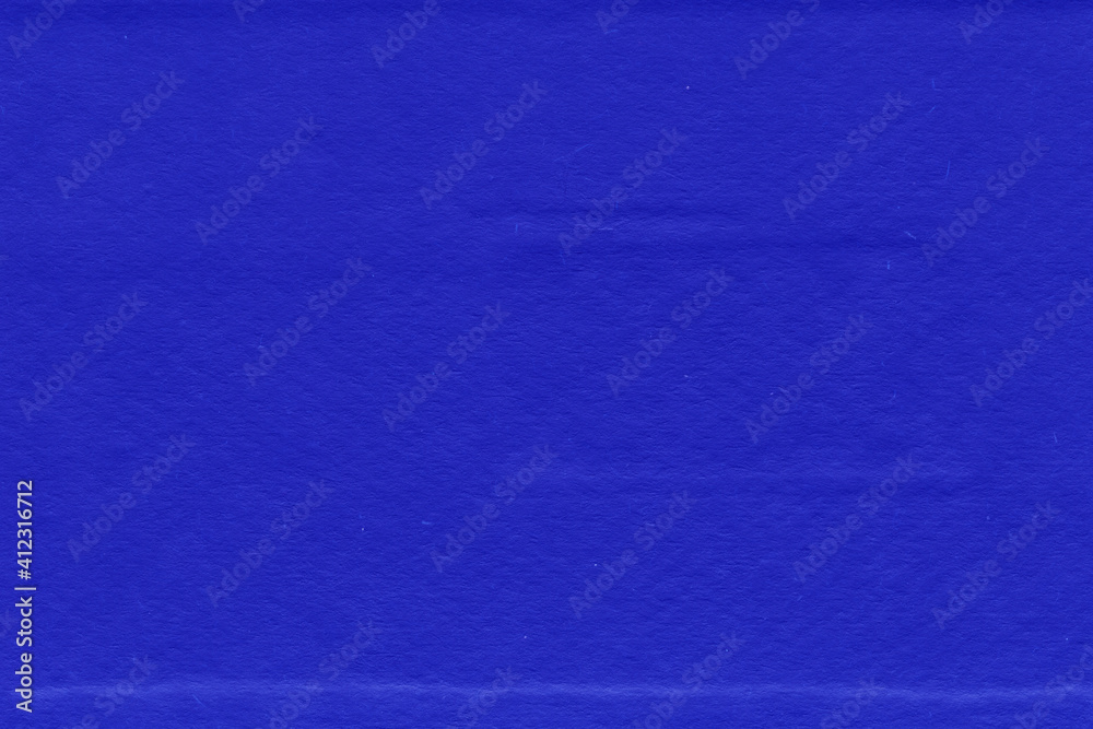 Fototapeta premium Cardboard blue abstract pattern texture close-up. Retro old paper background. Grunge concrete wall. Vintage blank wallpaper.