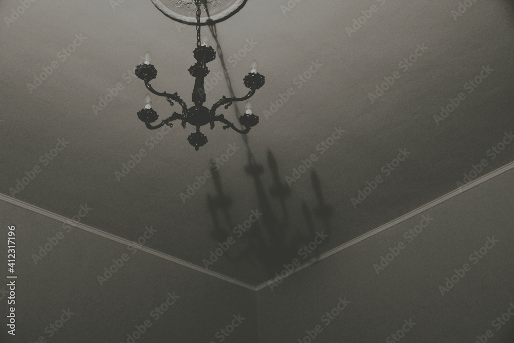 chandelier and roof. black and white abstract photo chandelier and roof. black and white abstract photo