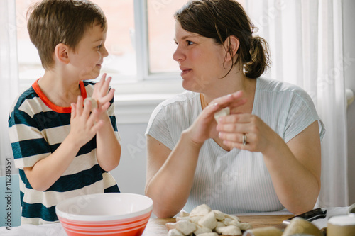 Mother and Son working together making Monkeybread photo