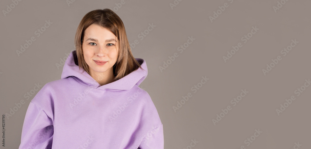 Portrait of young beautiful cute cheerful girl smiling looking at camera over gray background. Portrait of young beautiful cute cheerful girl smiling looking at camera over gray background.