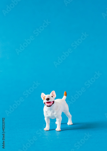 Amstaff dog shaped miniature on blue