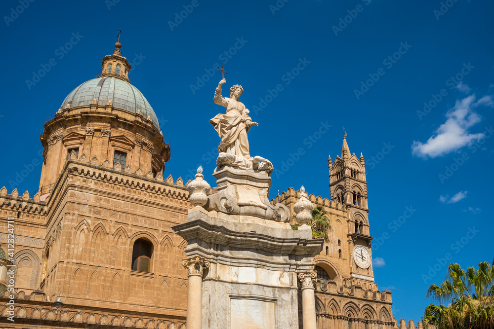 Sculpture in front of Palermo Cathedral church against blue sky, Sicily