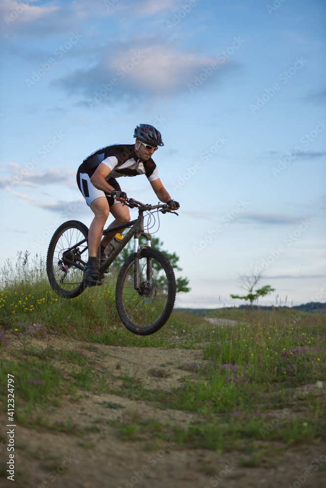 Man riding and jumping with his mountain bike outdoor Man riding and jumping with his mountain bike outdoor