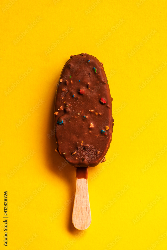 chocolate ice cream on the yellow background chocolate ice cream on the yellow background