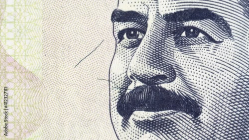 Saddam Hussein on Iraqi 100 dinar (2002) banknote tracking. Leader and president of Iraq. Slider shot photo