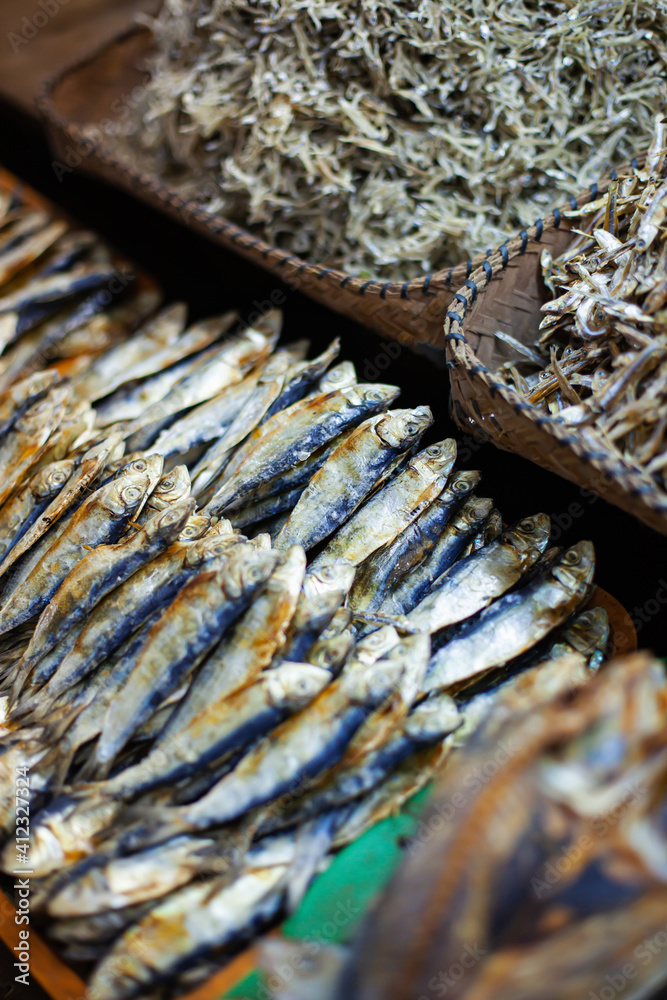 A lot of dried salted smelt at street market. Outdoors Food marketplace. Closeup