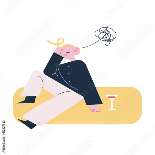 Young man sitting on floor suffering from hangover feeling unwell in morning